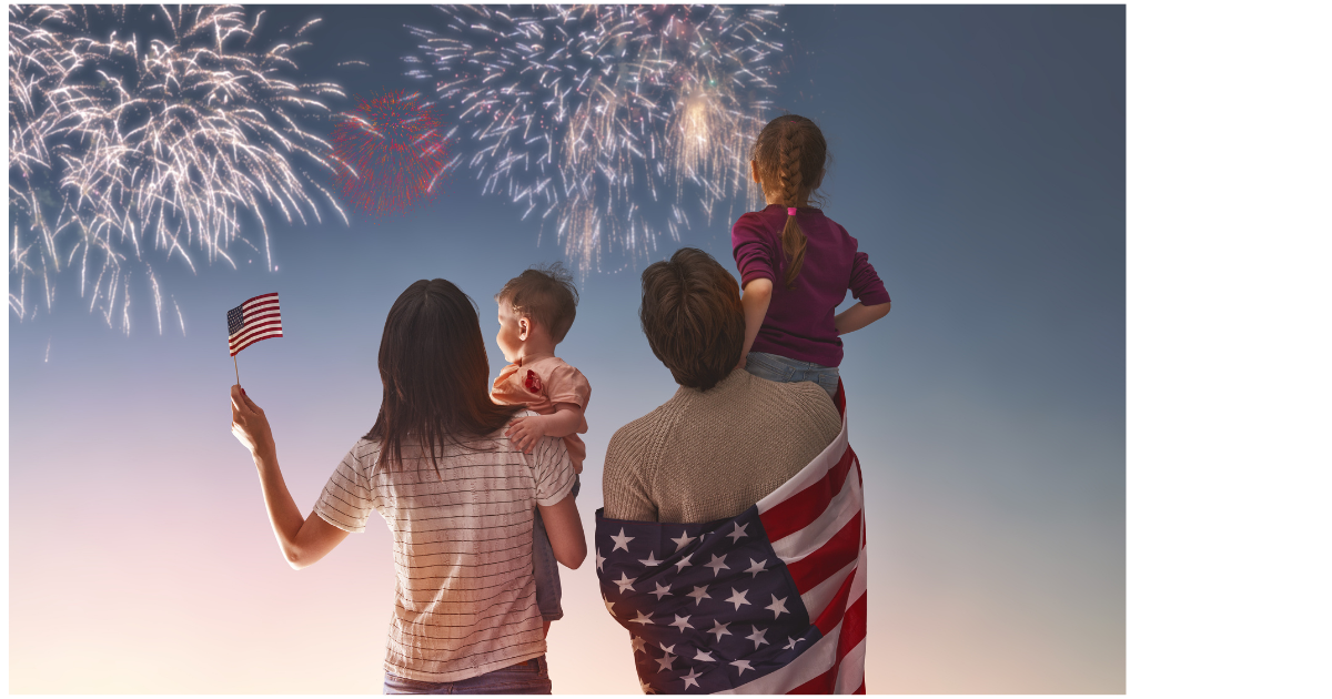 Family of four watching Fireworks with a USA flag in hand