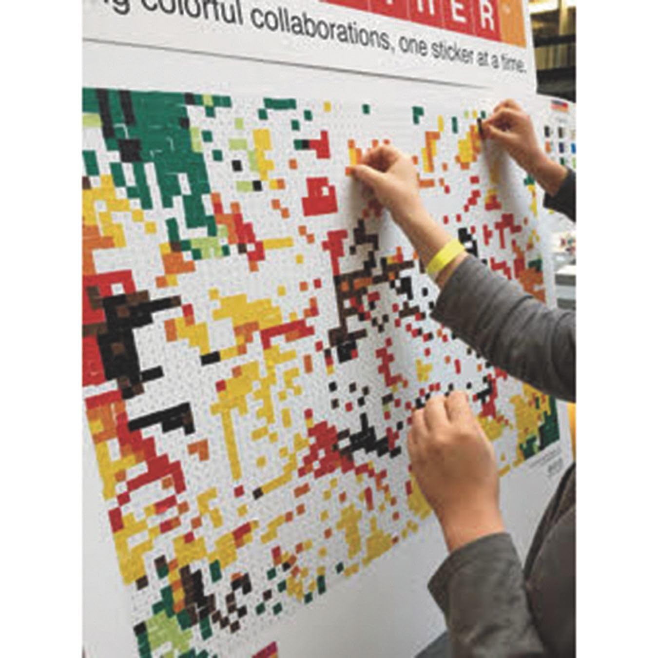 people putting stickers on board