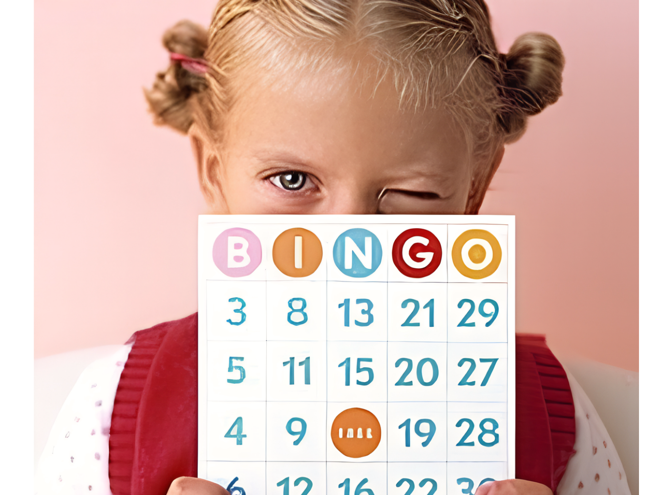 Child holding a card for BINGO