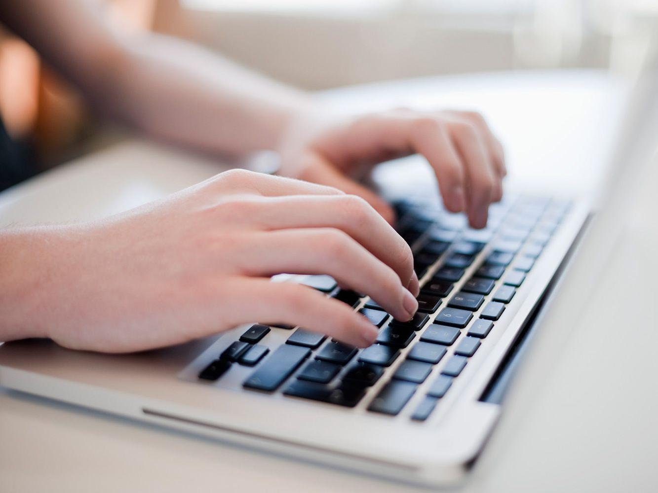 typing on laptop