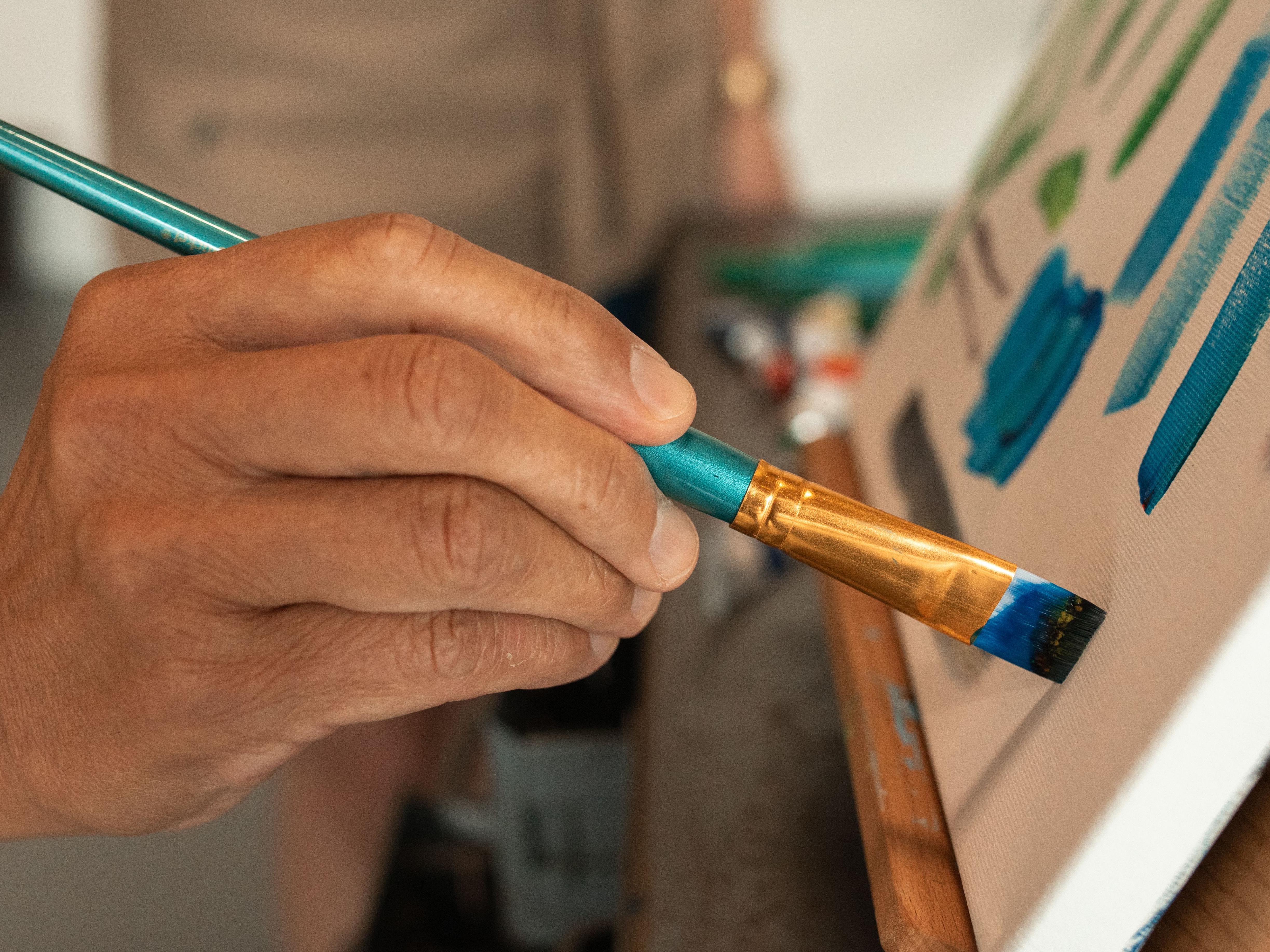 A Hand and a Paint Brush