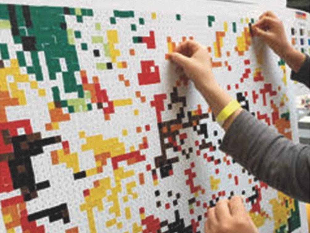 people putting stickers on board