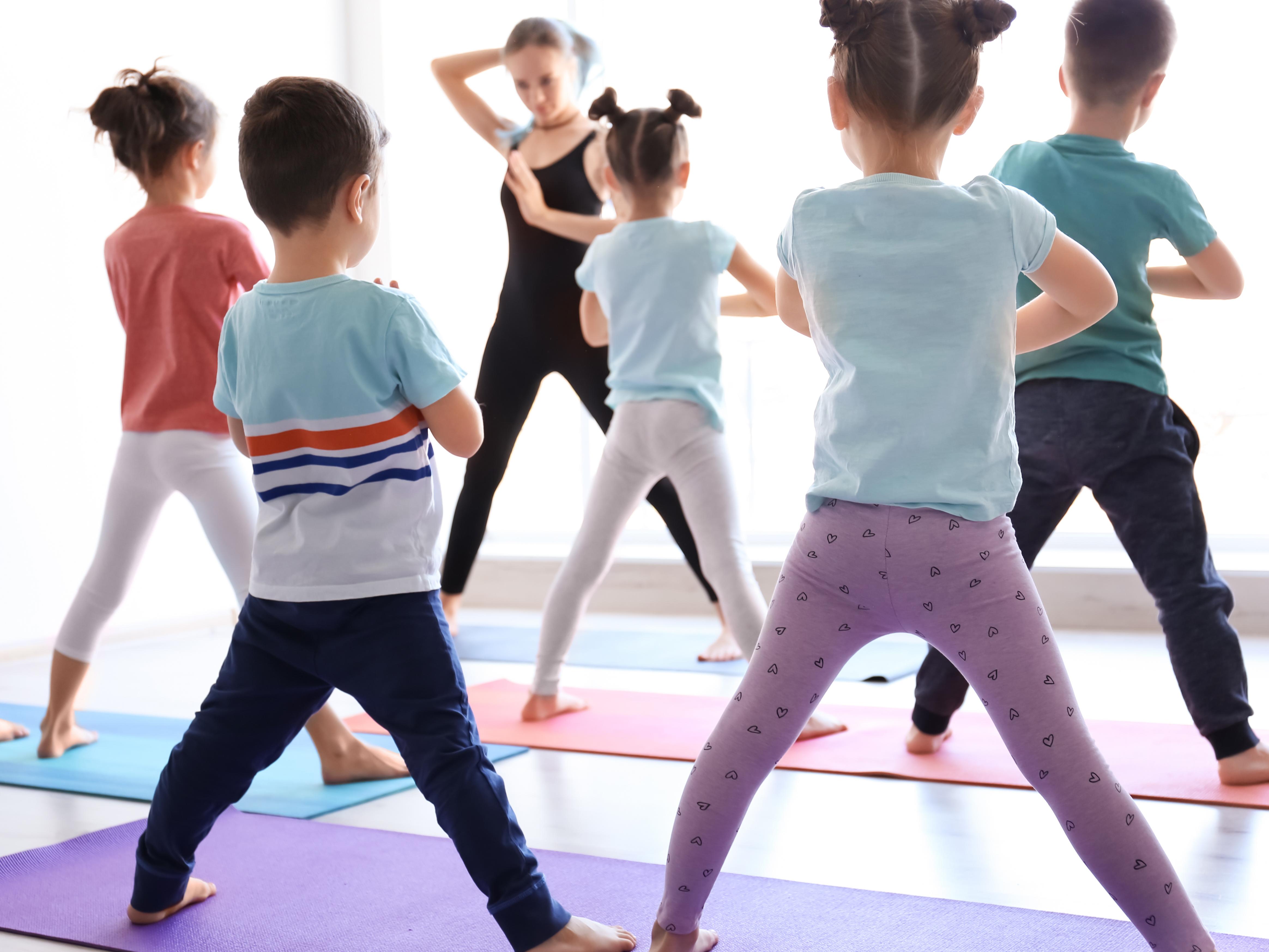 kids performing Yoga in class